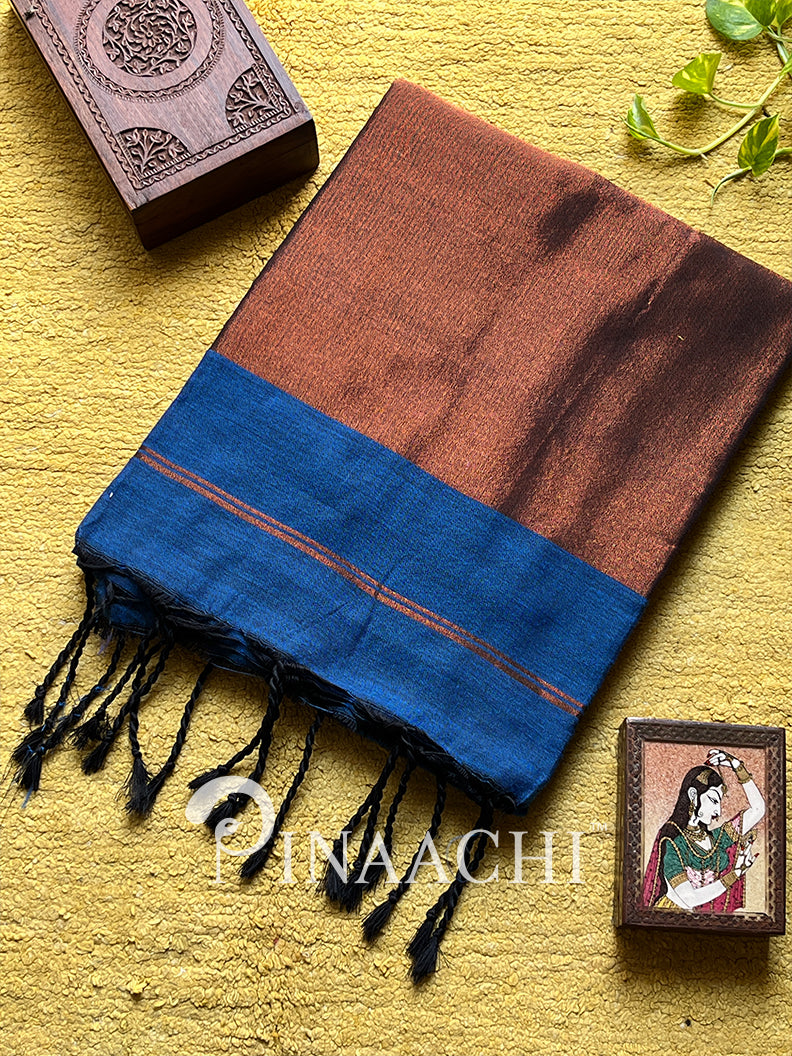 Elegant peacock blue cotton saree with rich brown borders and delicate tassels