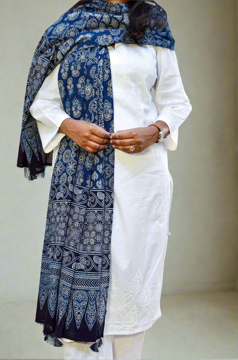 Ajrak hand block printed dupatta in blue, elegantly styled with a white kurta for a traditional look