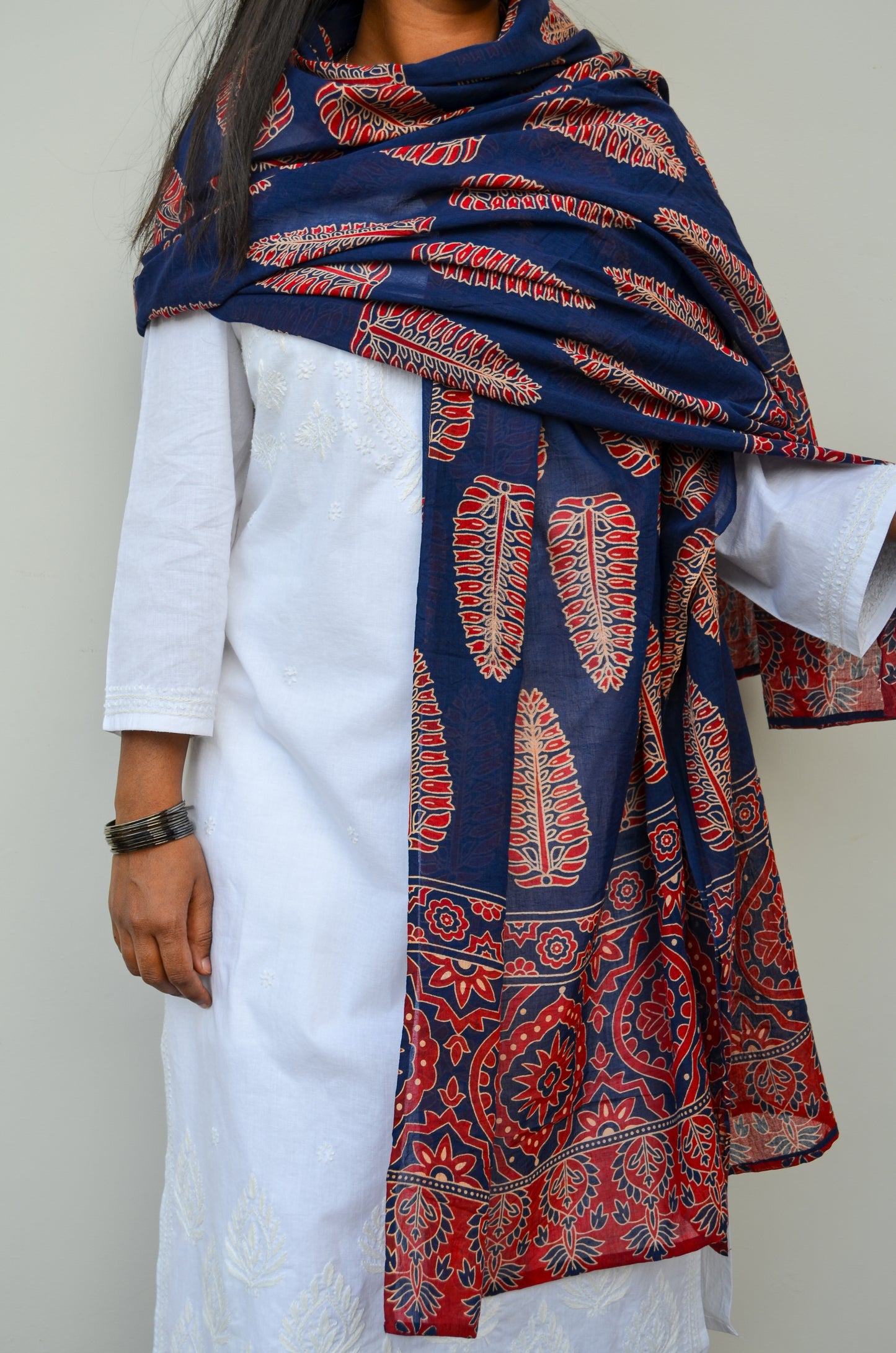 Pinaachi Ajrakh hand block printed cotton dupatta in navy blue with intricate designs and vibrant colors