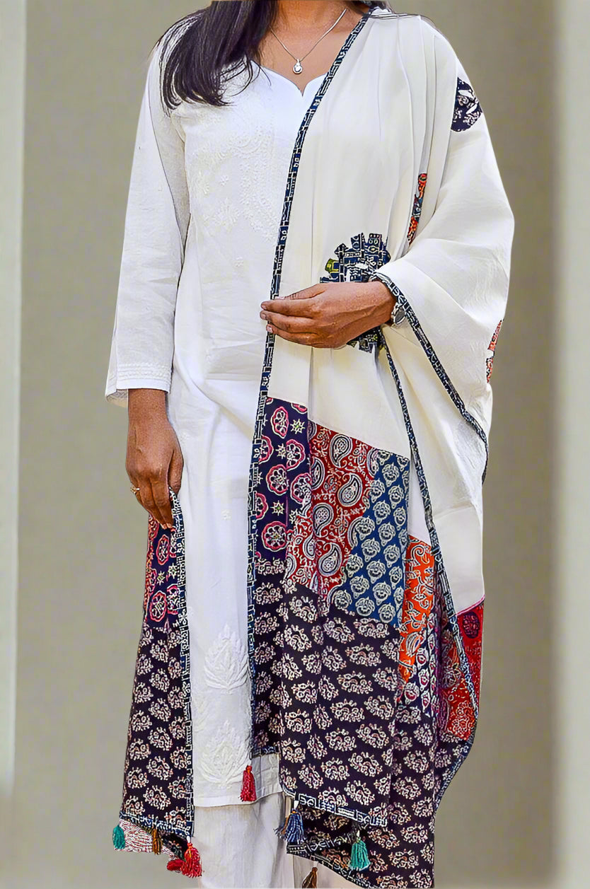 Elegant Ajrakh hand block printed dupatta featuring vibrant patterns and tassels for stylish women