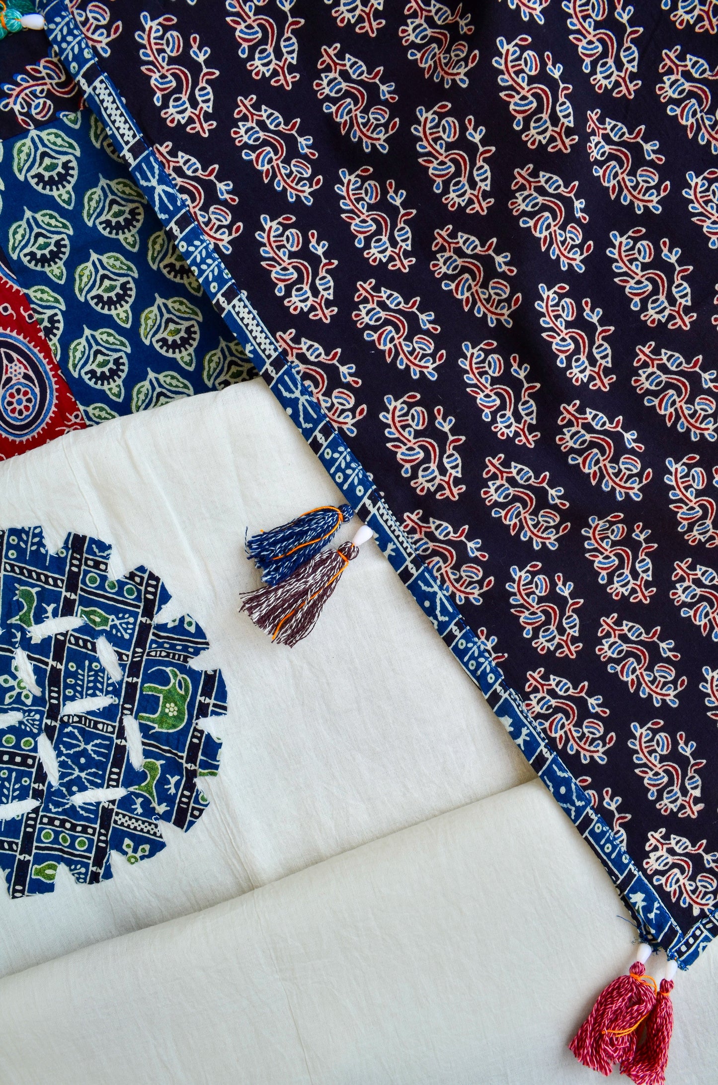 Ajrakh hand block printed dupatta with vibrant patterns and decorative tassels for elegant styling