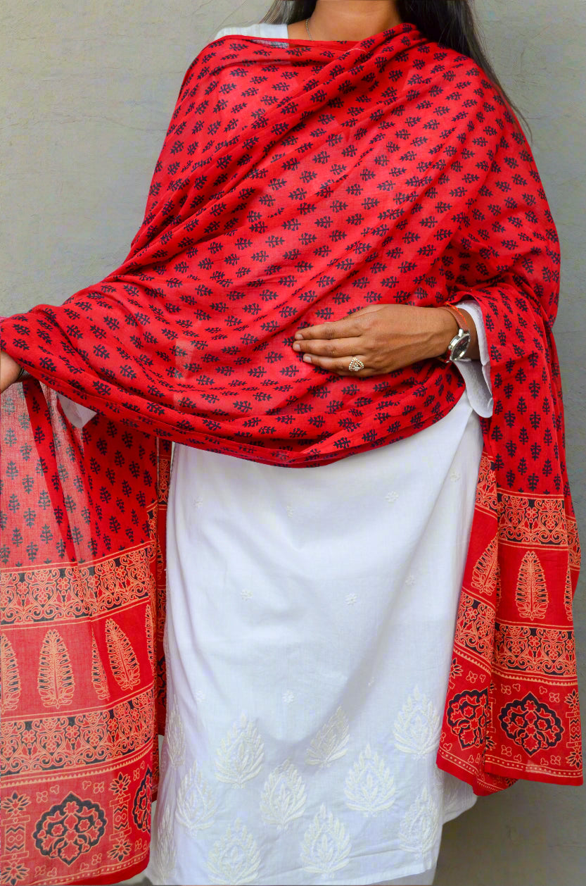 Elegant red Ajrakh hand block printed dupatta draped over a white kurta for a traditional look