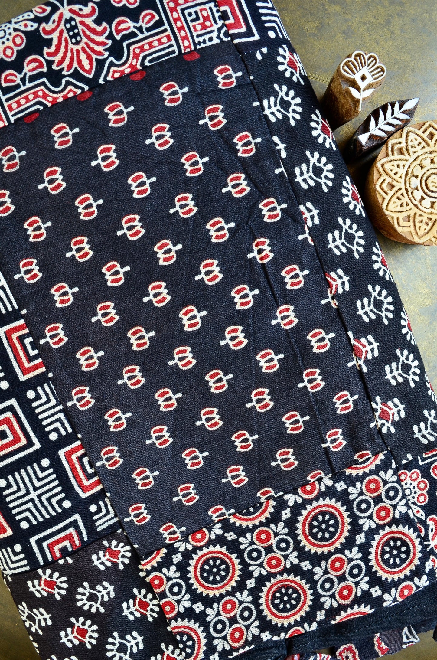 Ajrakh hand block printed dupatta in black with intricate patterns and vibrant colors