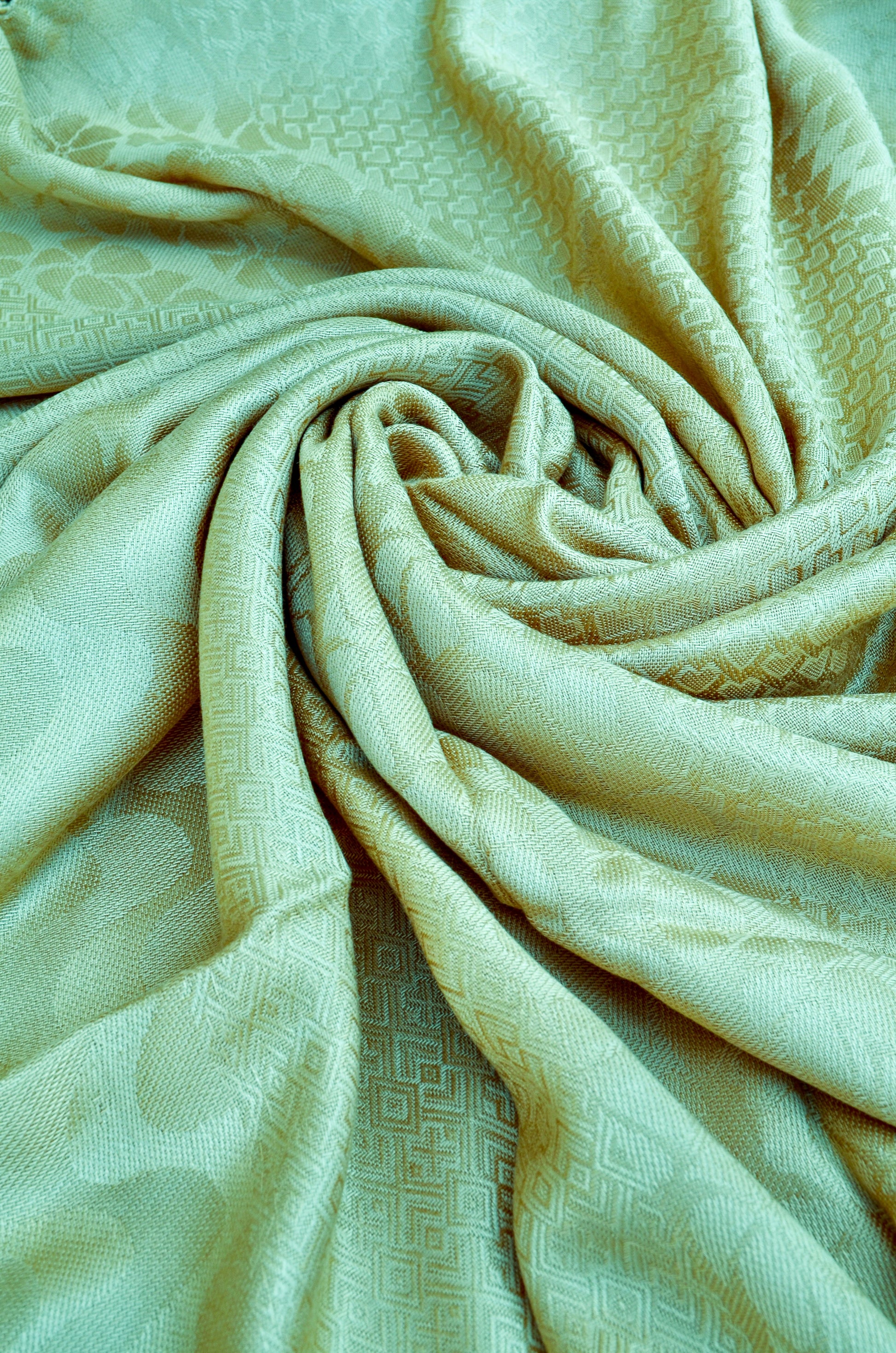 Soft beige jacquard stole with intricate patterns, perfect for stylish layering and comfort