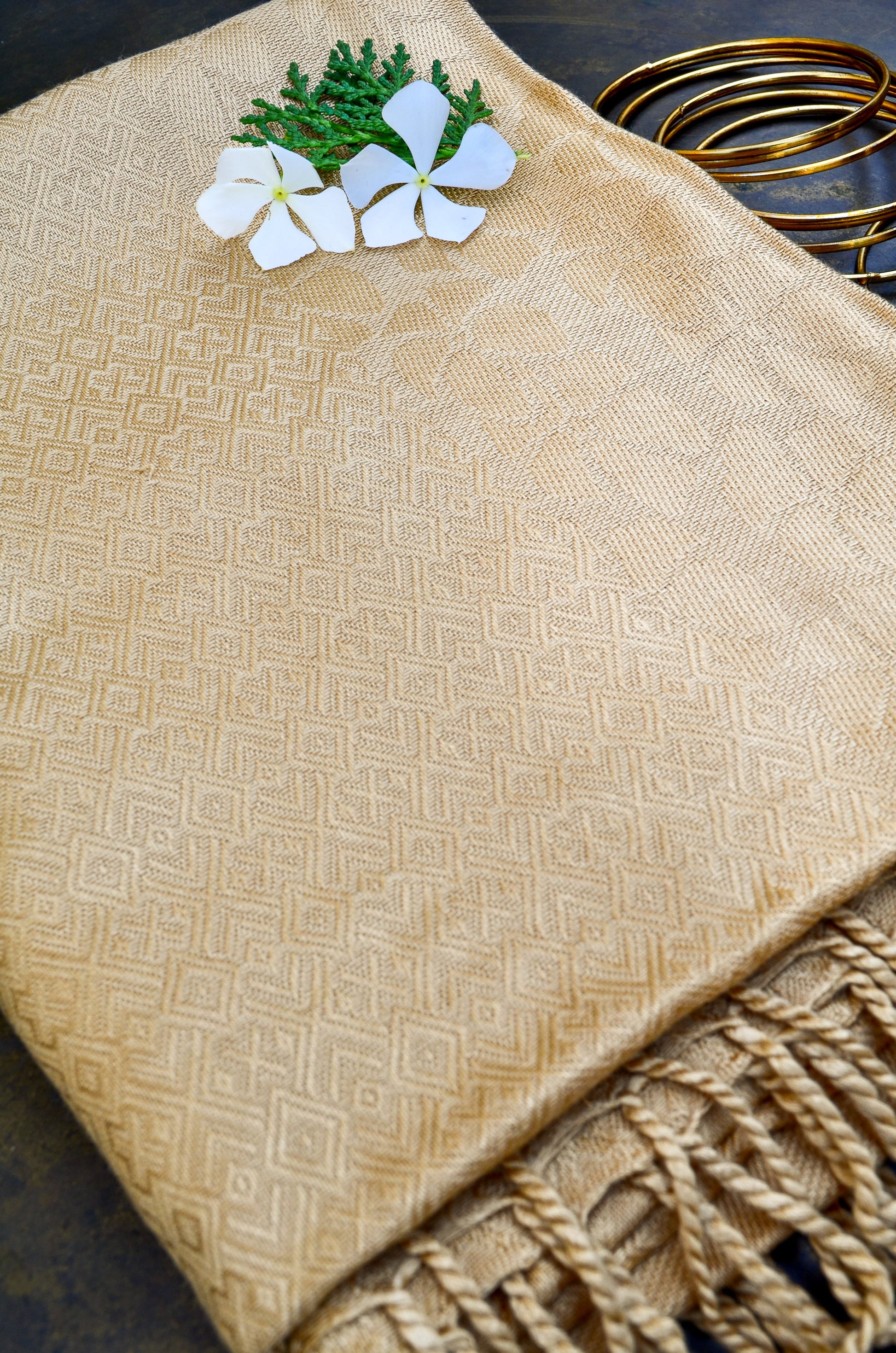 Beige jacquard stole with elegant pattern, adorned with flowers and greenery for a sophisticated look