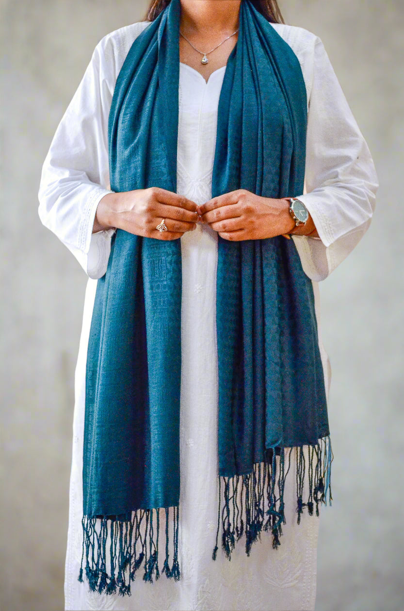 Elegant black green jacquard stole draped stylishly with fringed edges for versatile wear