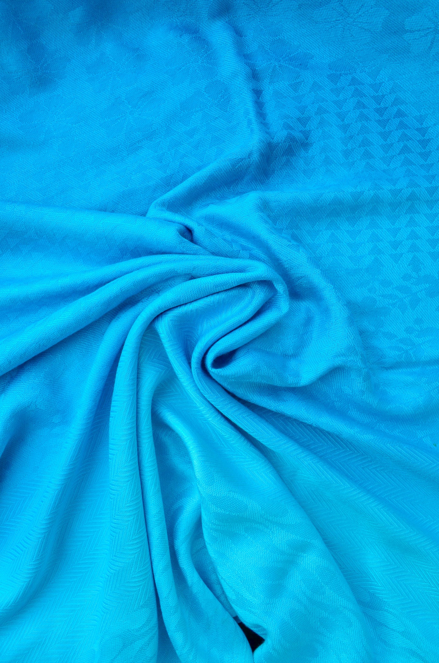 Soft blue gradient jacquard stole with intricate textured pattern for stylish layering