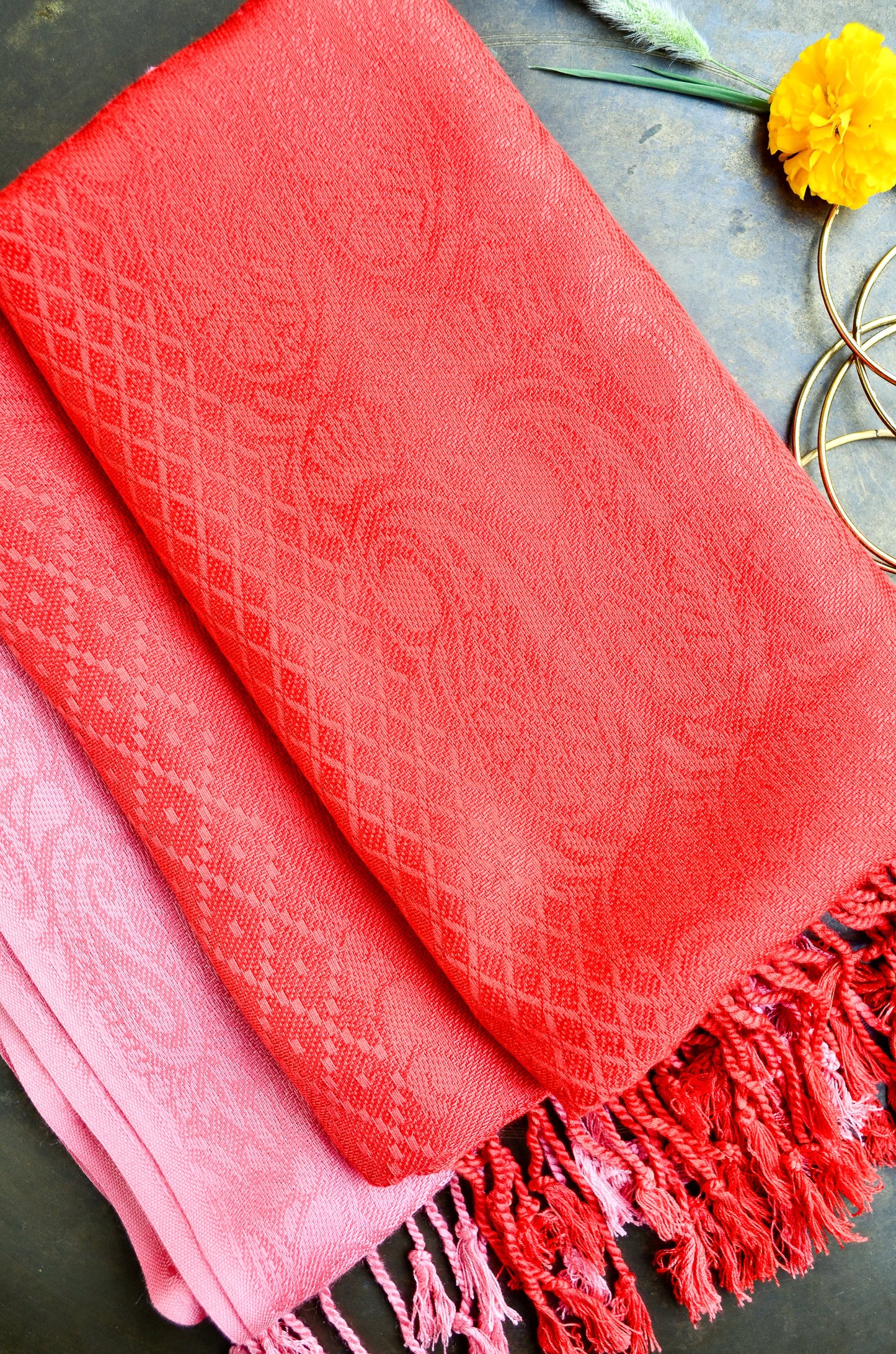 Crimson jacquard stole by Pinaachi featuring intricate texture and stylish fringes