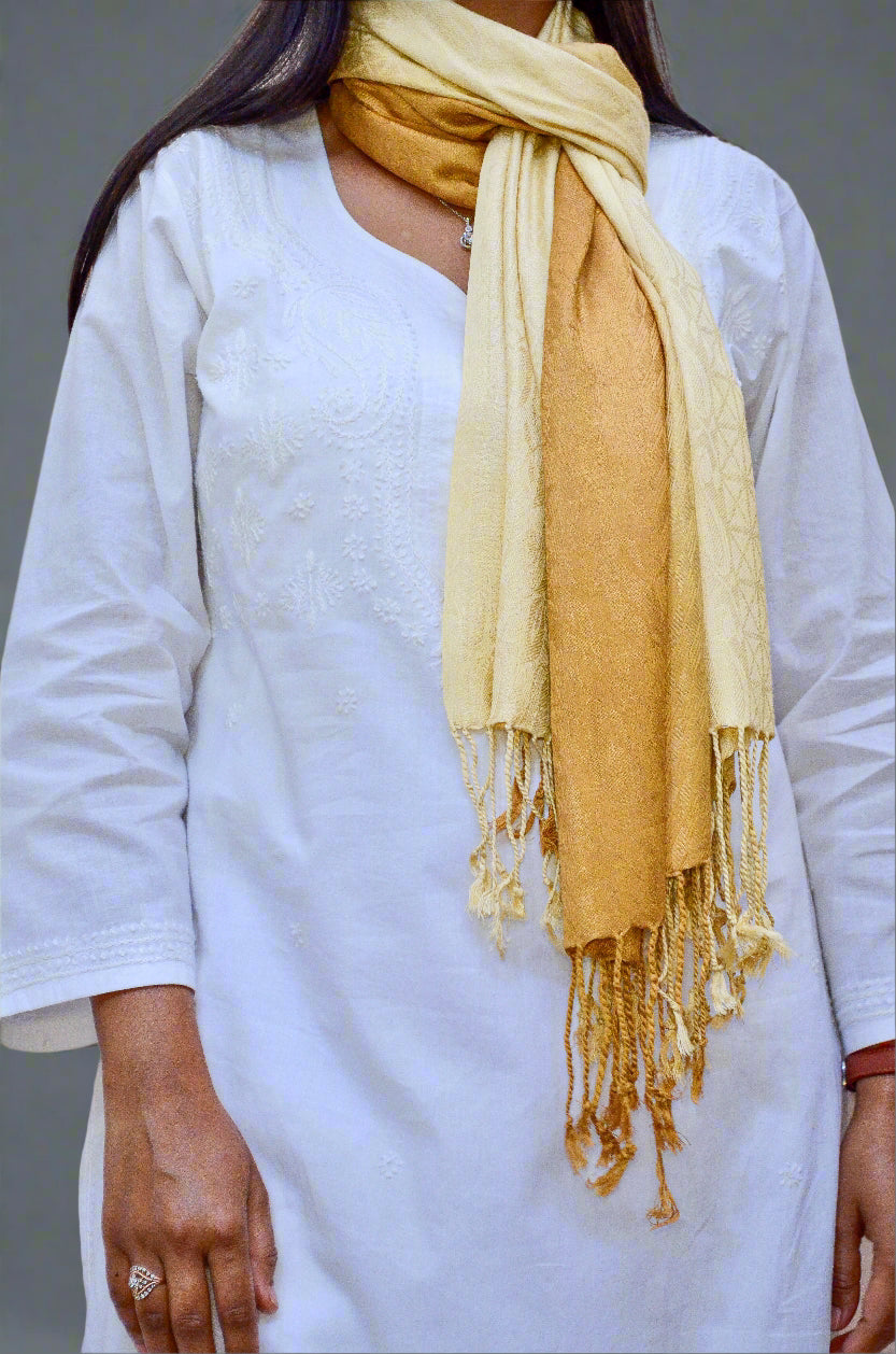 Elegant golden jacquard stole draped stylishly around a model's neck with a white outfit