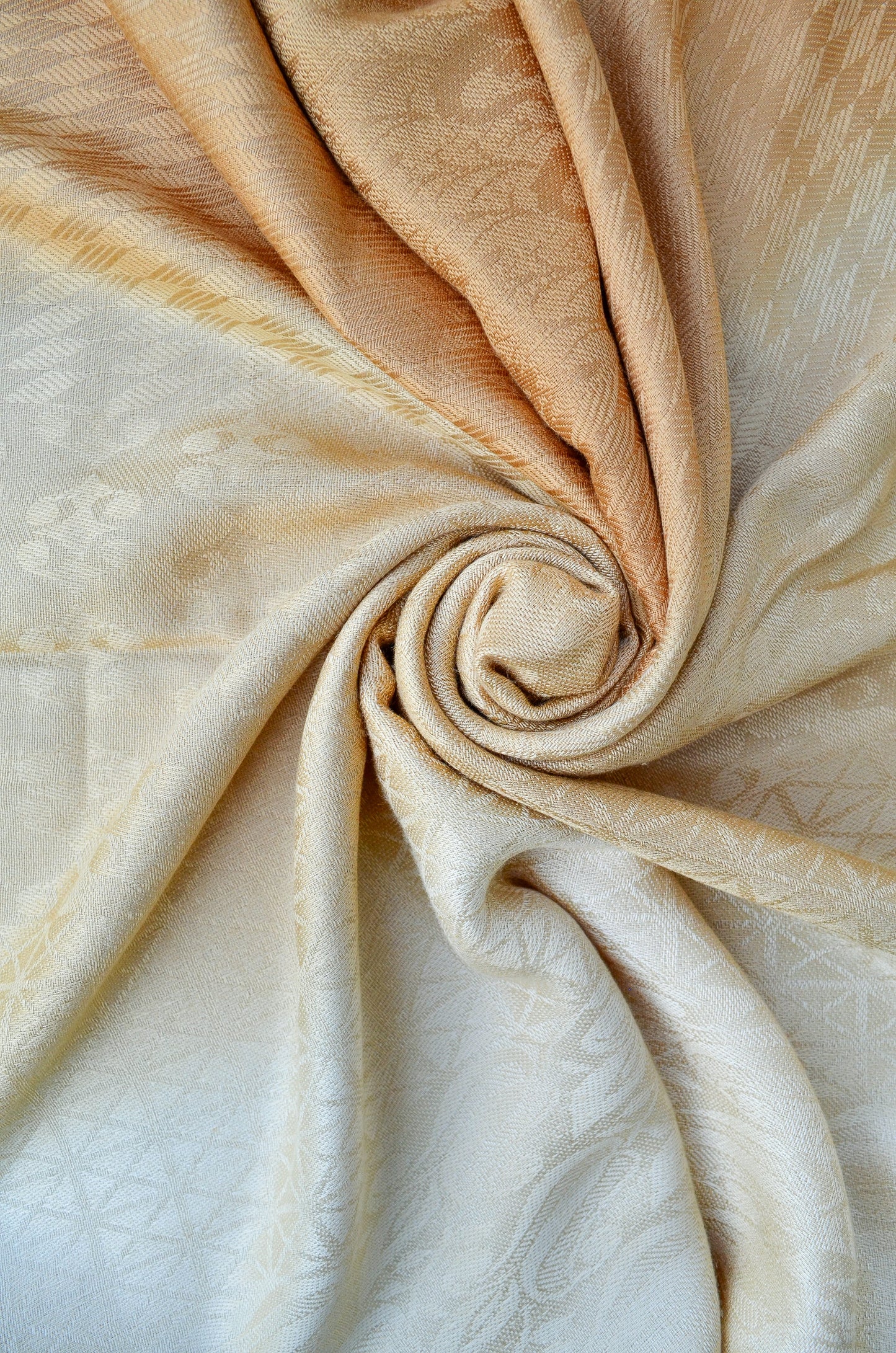 Golden jacquard stole with intricate patterns for elegant styling and warmth