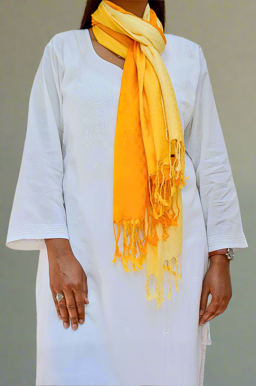 Model wearing a golden yellow jacquard stole styled elegantly with a white outfit