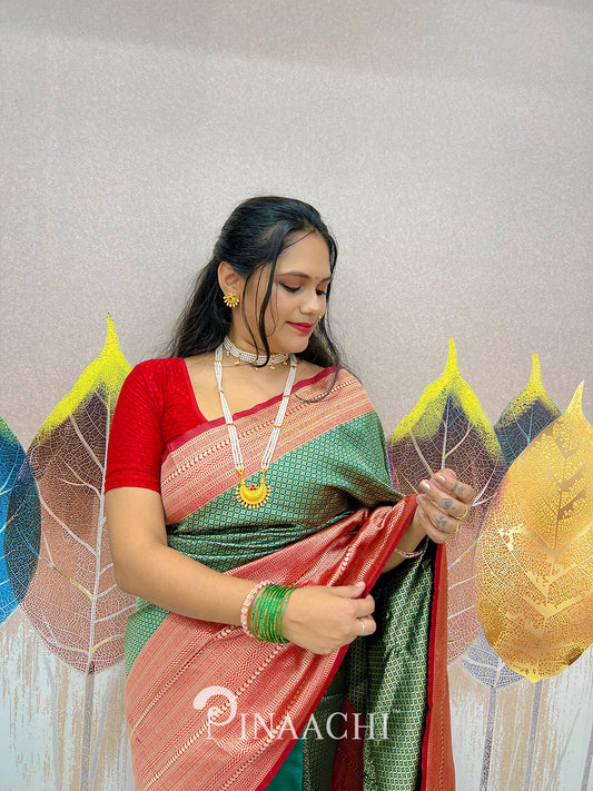 Elegant green lichi silk saree with intricate patterns, styled with a red blouse for a sophisticated look