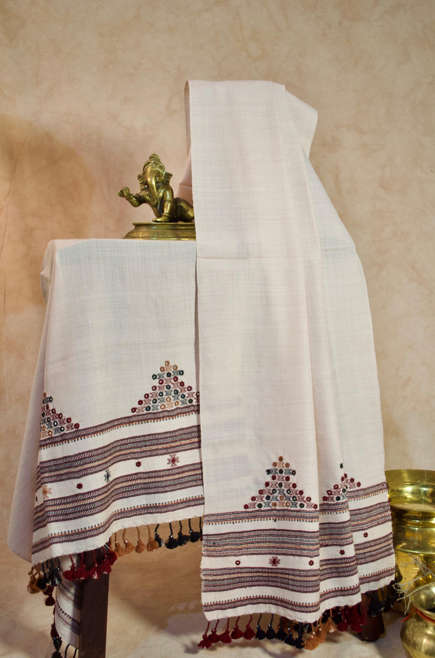 Elegant hand woven merino wool stole with intricate embroidery and tassels for stylish warmth