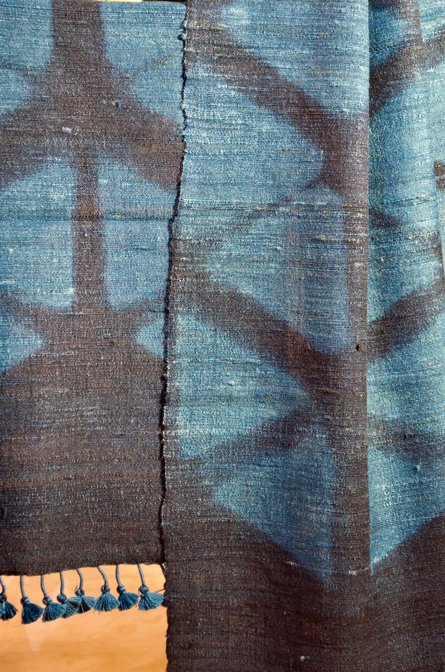Elegant handwoven merino wool stole in deep blue and black with intricate patterns