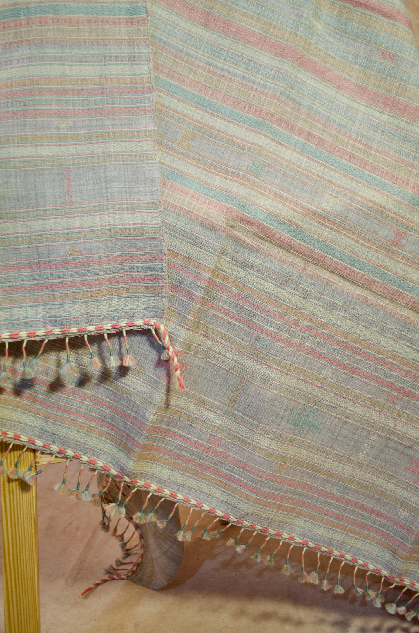 Kutchhi traditional shawl with vibrant stripes and decorative fringes for elegant layering