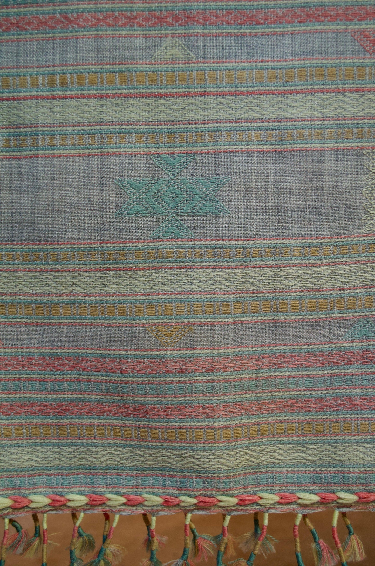Kutchhi traditional shawl with intricate patterns and colorful fringes for stylish warmth