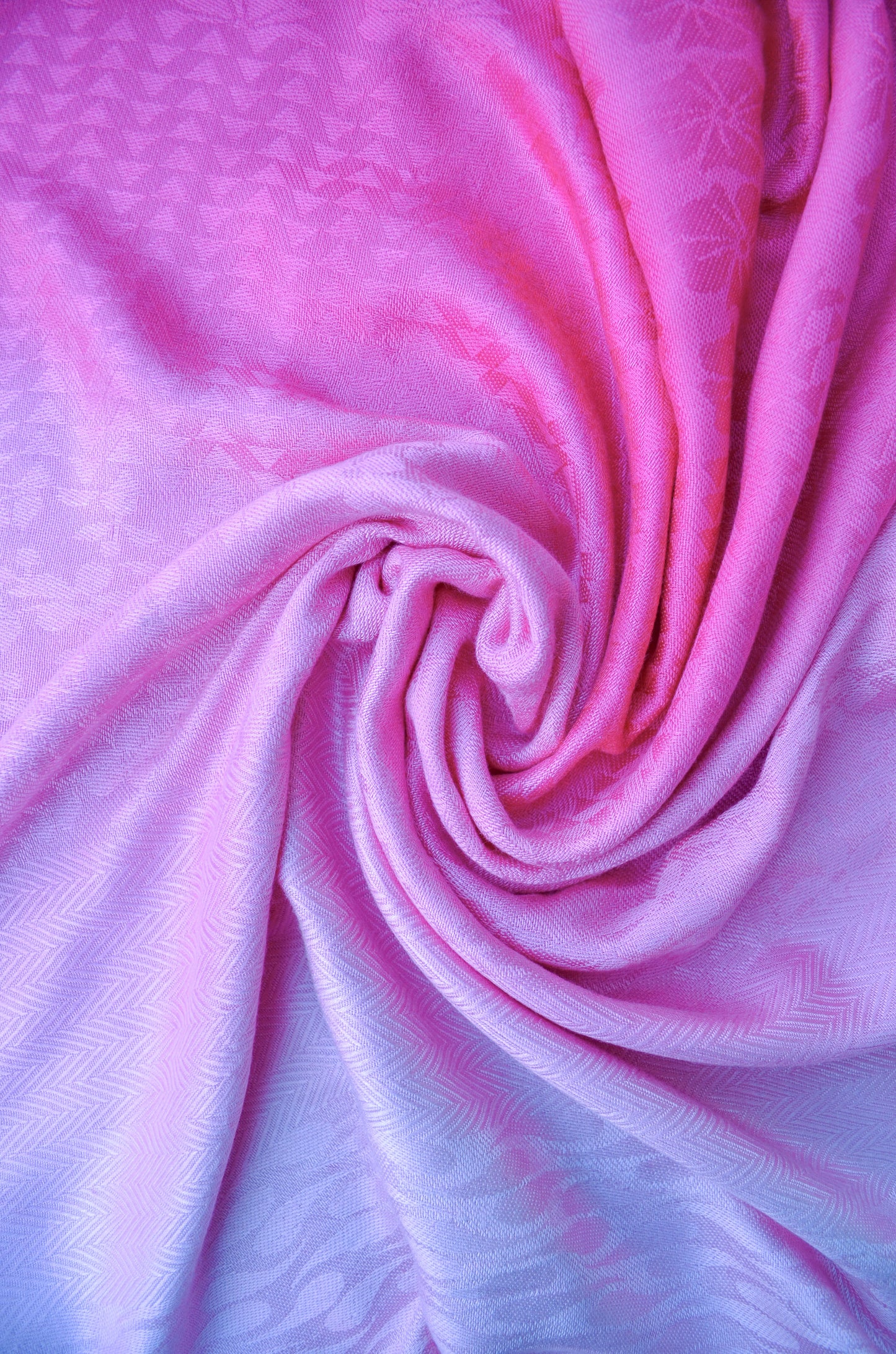 Light pink gradient jacquard stole featuring a smooth and luxurious texture