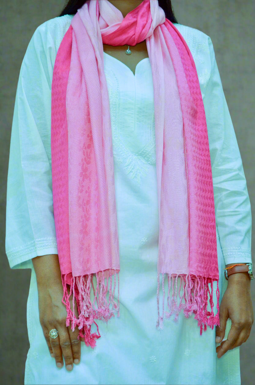 Light pink gradient jacquard stole draped elegantly over a white outfit for a stylish look
