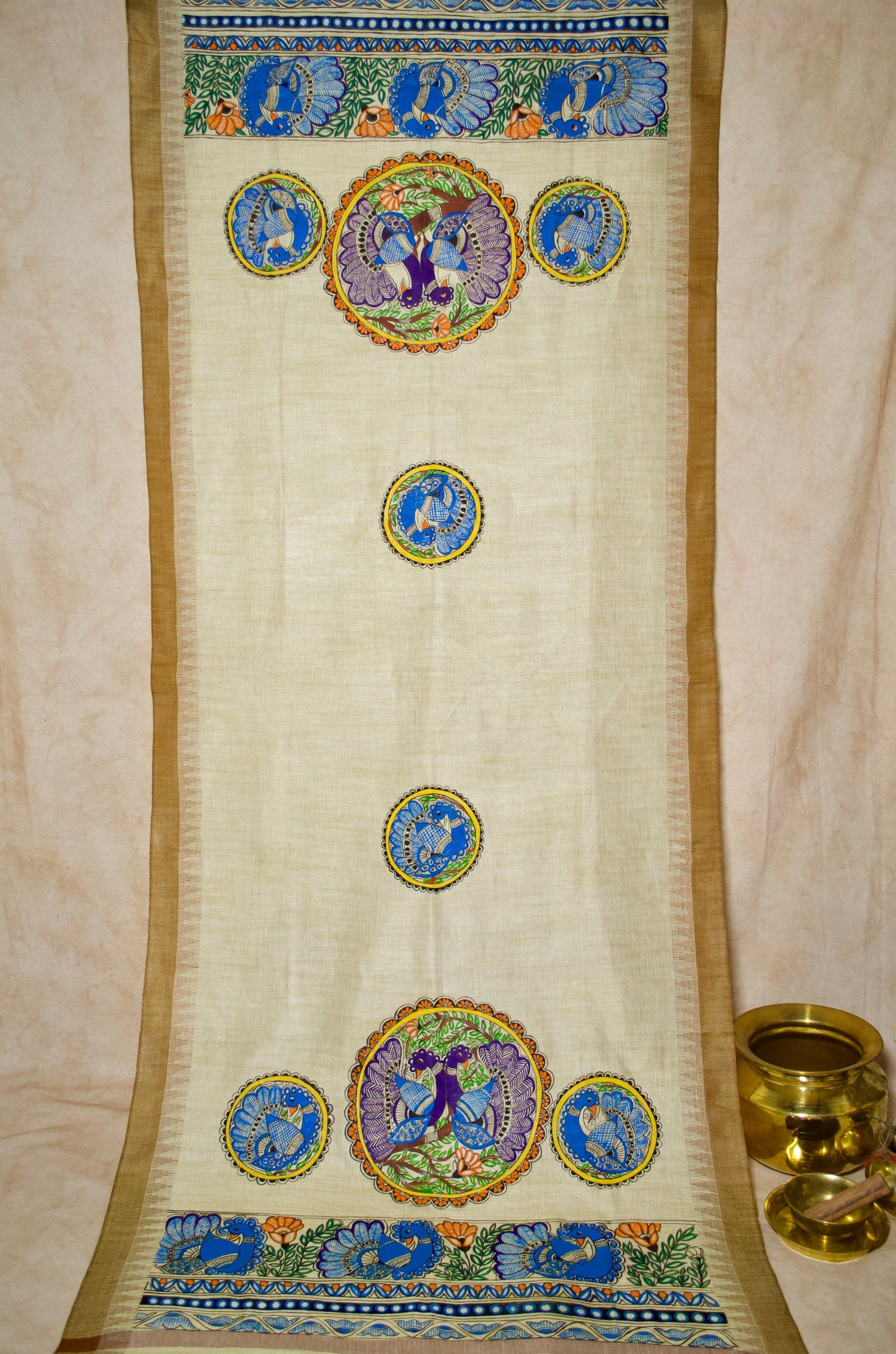 Niva Madhubani hand painted dupatta featuring intricate designs and vibrant colors on a cream background