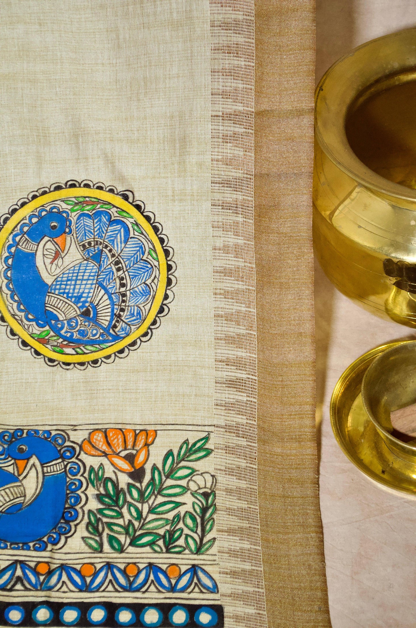 Madhubani hand painted dupatta with intricate designs and vibrant colors on a light background
