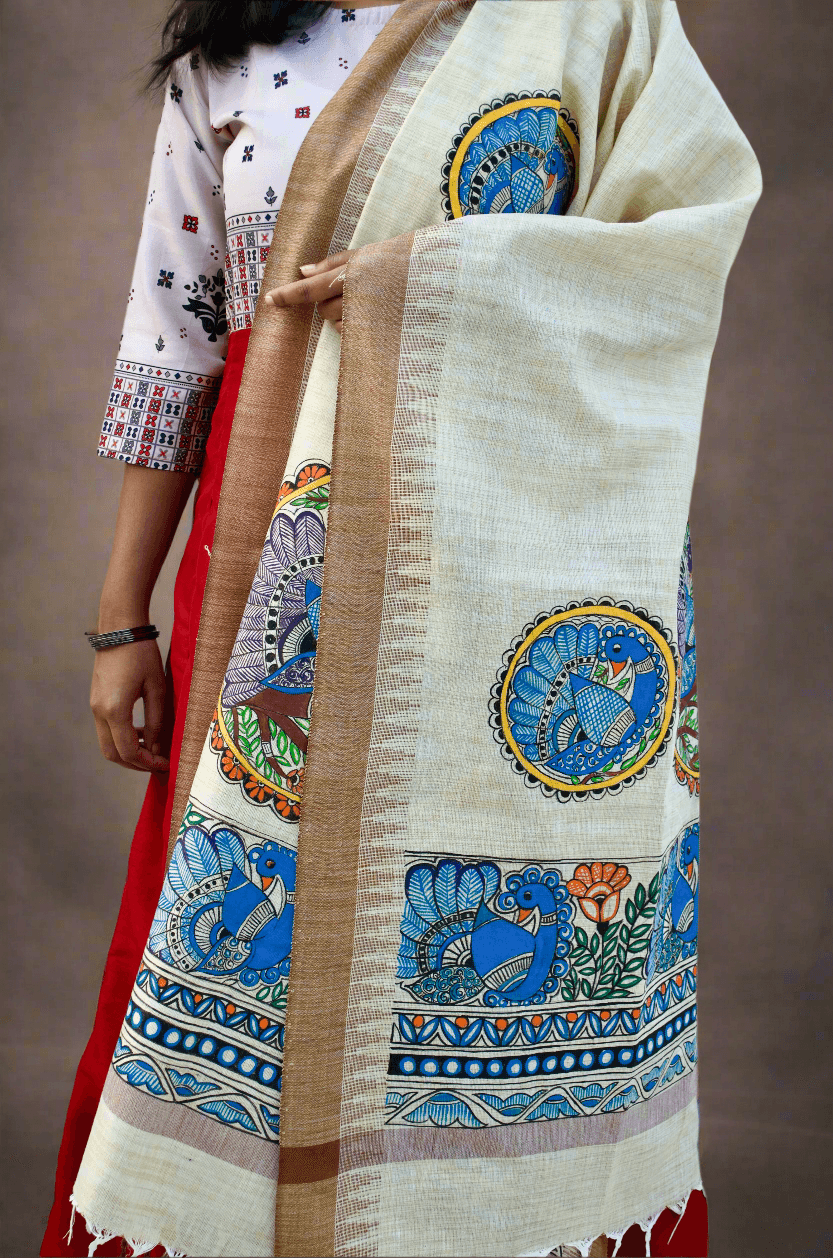 Elegant Madhubani hand painted dupatta featuring vibrant tribal designs on a cream background