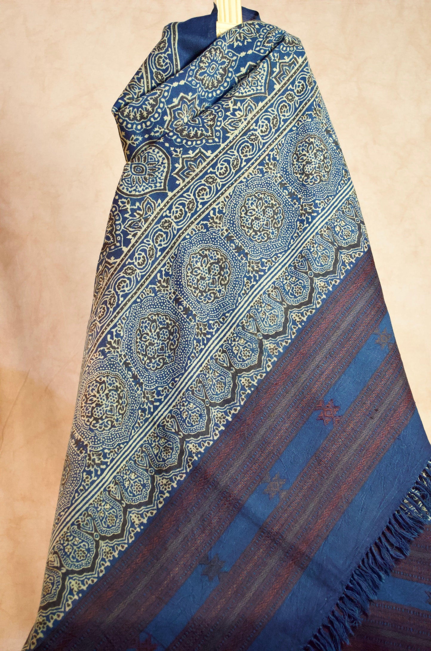 Stylish Merino wool Ajrakh shawl with intricate blue and maroon patterns, perfect for elegant layering