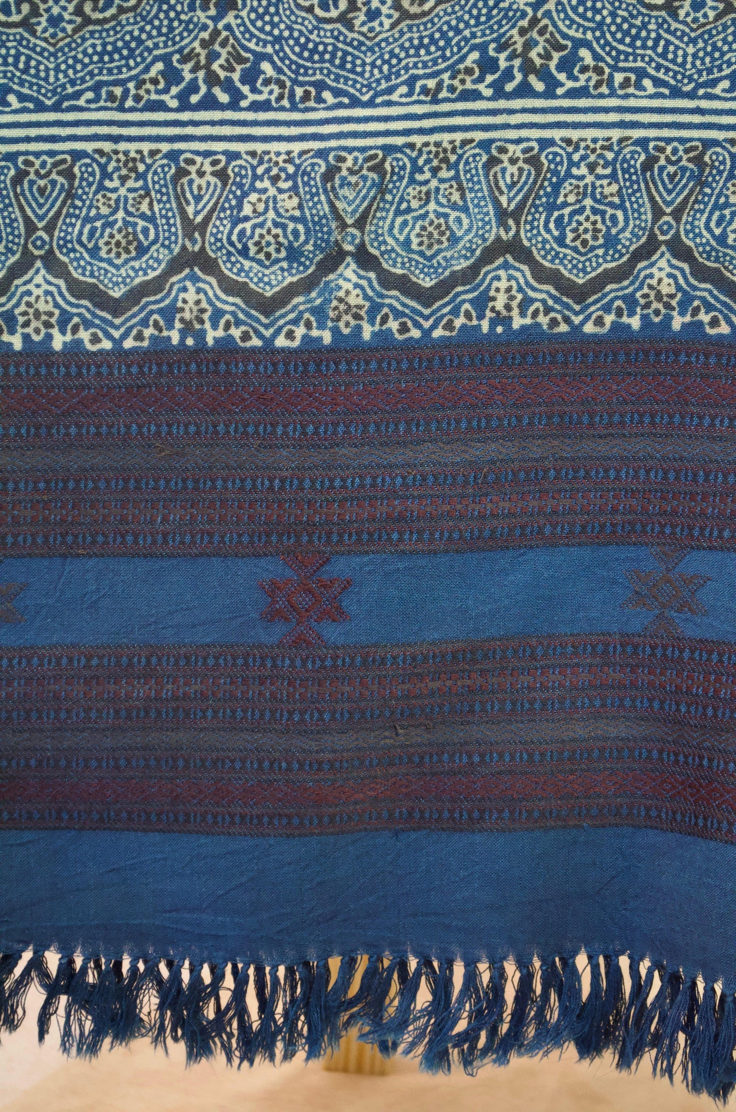 Handcrafted Merino wool Ajrakh shawl in blue with intricate patterns and fringe detailing