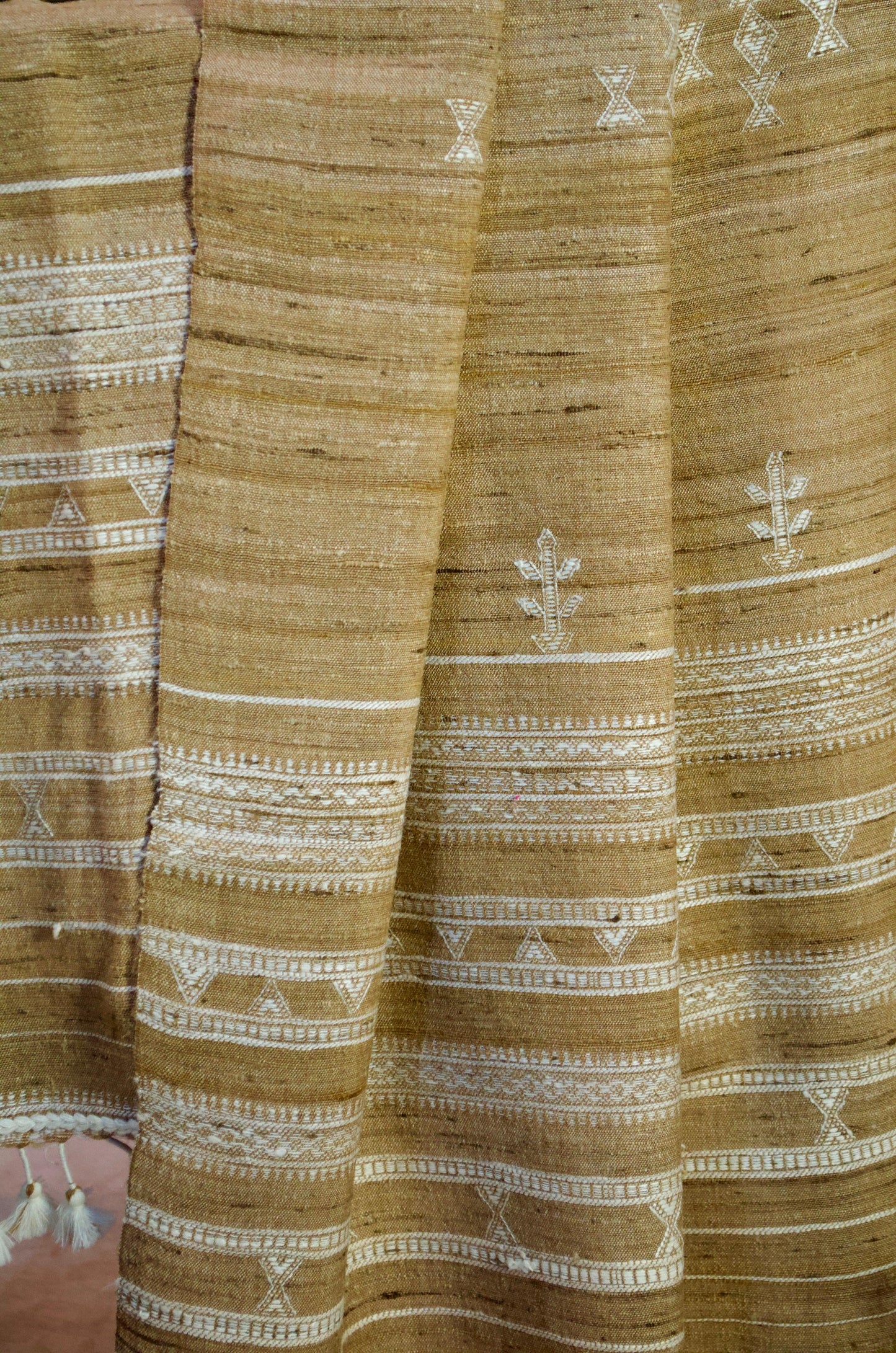 Elegant Merino wool and Tasar silk stole with intricate embroidery and tassels for stylish layering