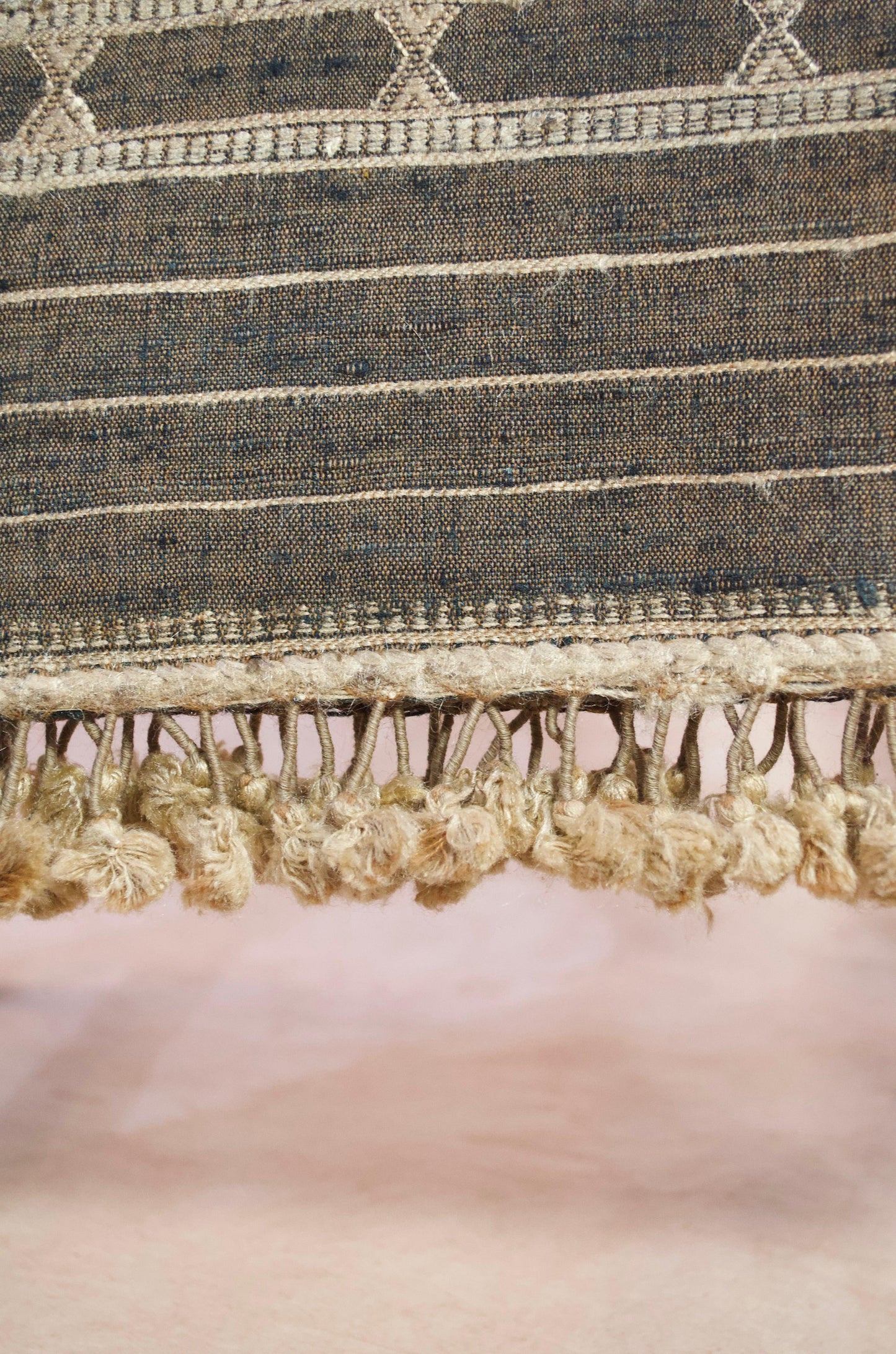 Close-up of a merino wool tasar silk stole with intricate designs and fringed edges
