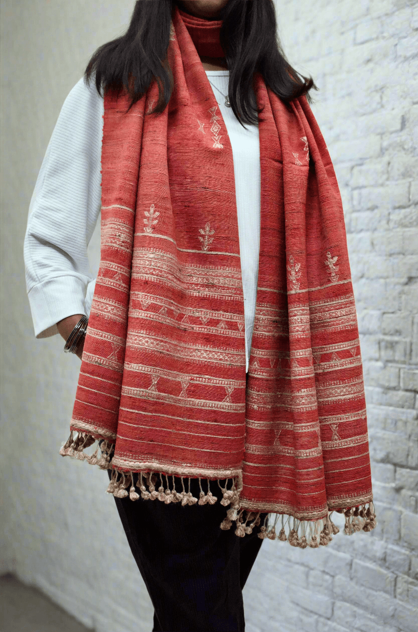 Elegant Merino wool Tasar silk stole with intricate patterns and tassel detailing, perfect for stylish layering