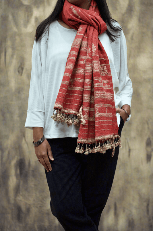 Elegant Merino wool Tasar silk stole in red, featuring intricate designs and tassel ends, perfect for any outfit.