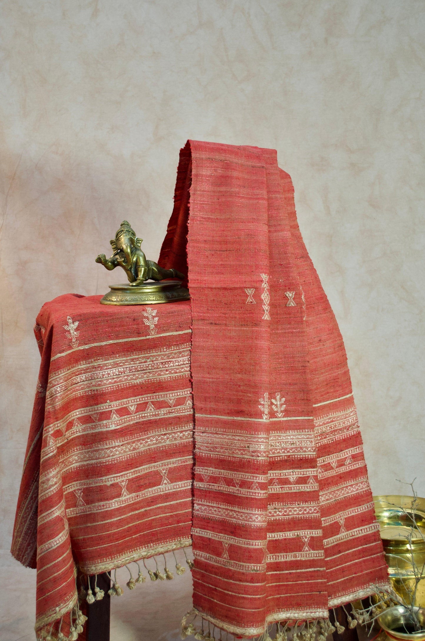 Handcrafted Merino wool Tasar silk stole in vibrant red with intricate patterns and fringed edges