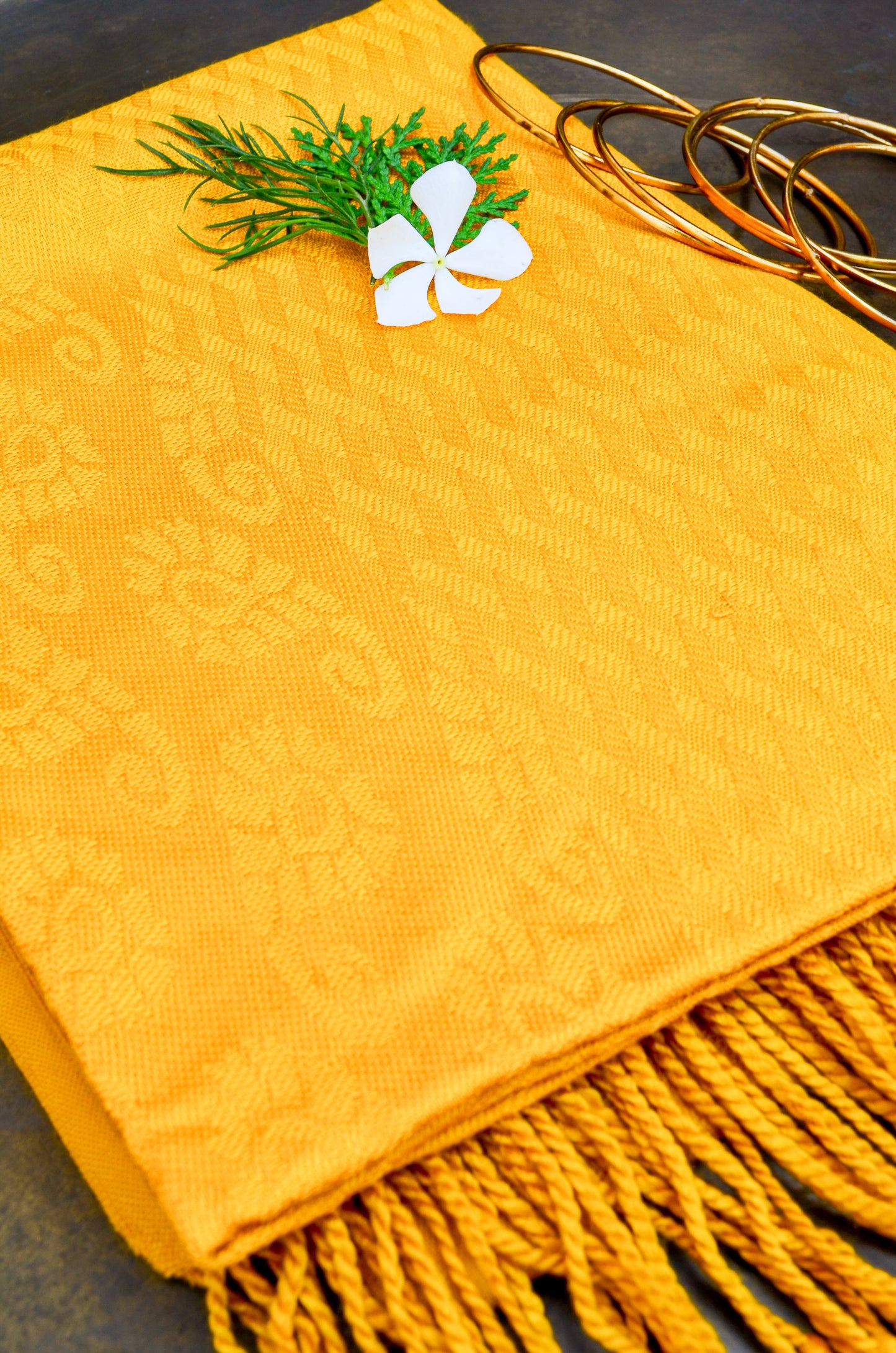 Pinaachi mustard yellow jacquard stole with intricate patterns and fringed edges
