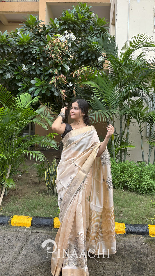 Elegant off-white tussar silk saree by Pinaachi, styled with intricate designs for a chic look