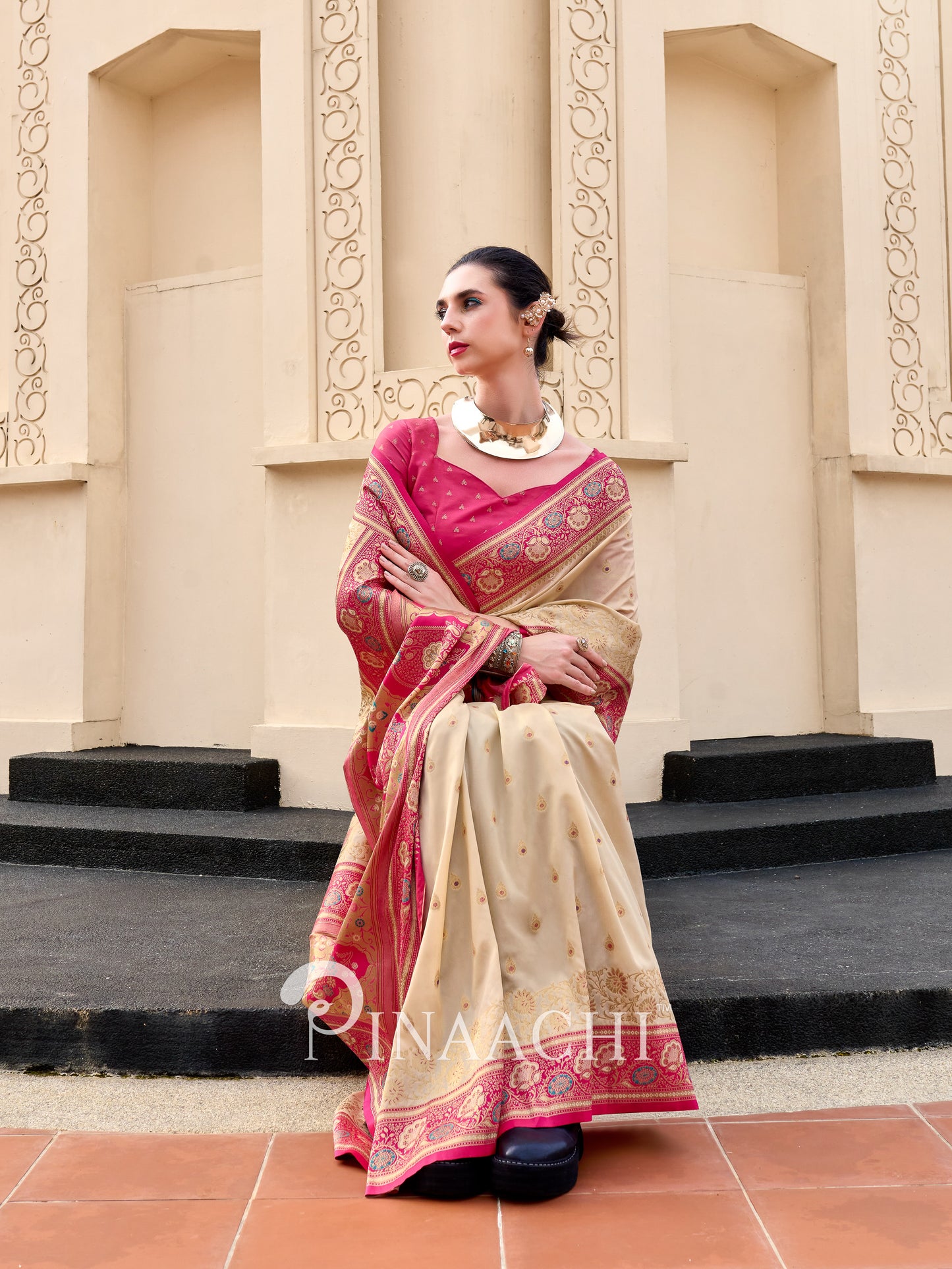 Elegant Banarasi silk saree for wedding in cream and pink with intricate golden embroidery