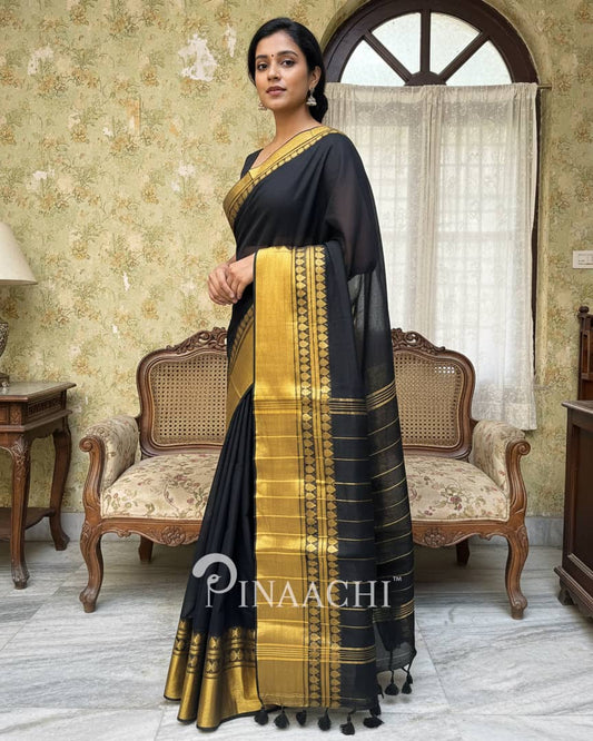 Pinaachi black saree in cotton with a golden border and elegant tassels for festive occasions