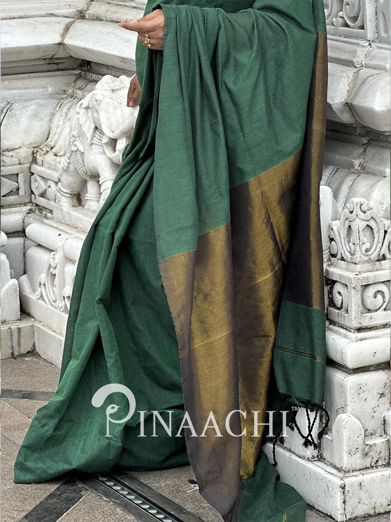 Elegant emerald green cotton saree by Pinaachi with a stylish gold and black border