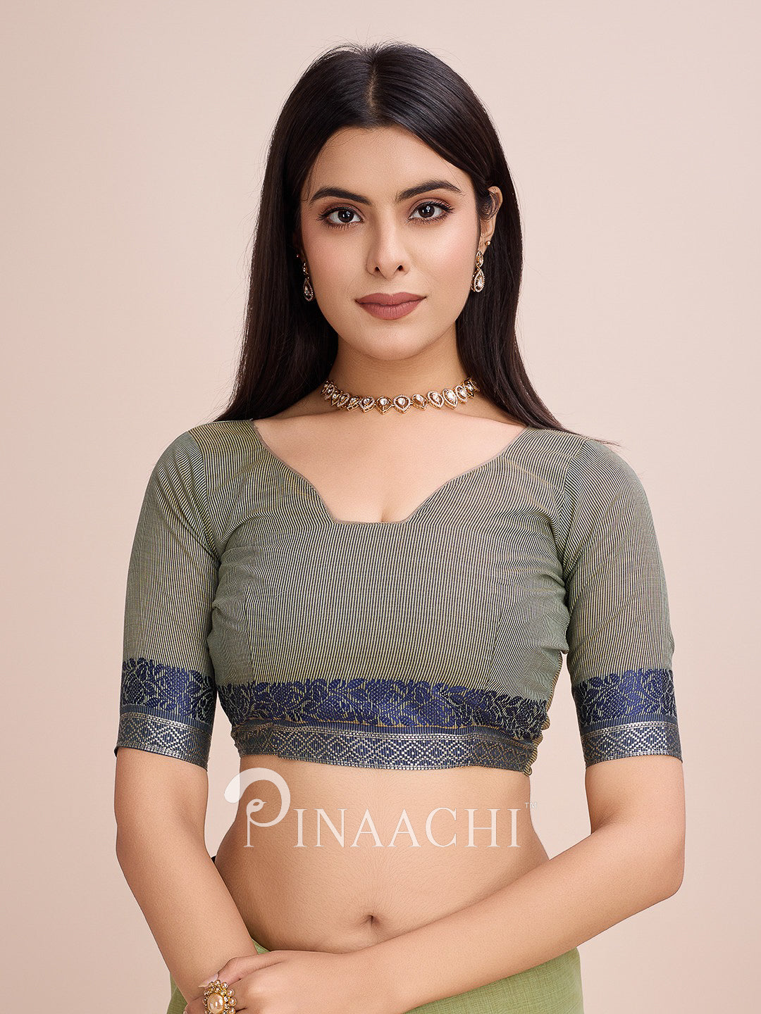 Pinaachi green cotton saree with woven border featuring a stylish blouse and elegant design