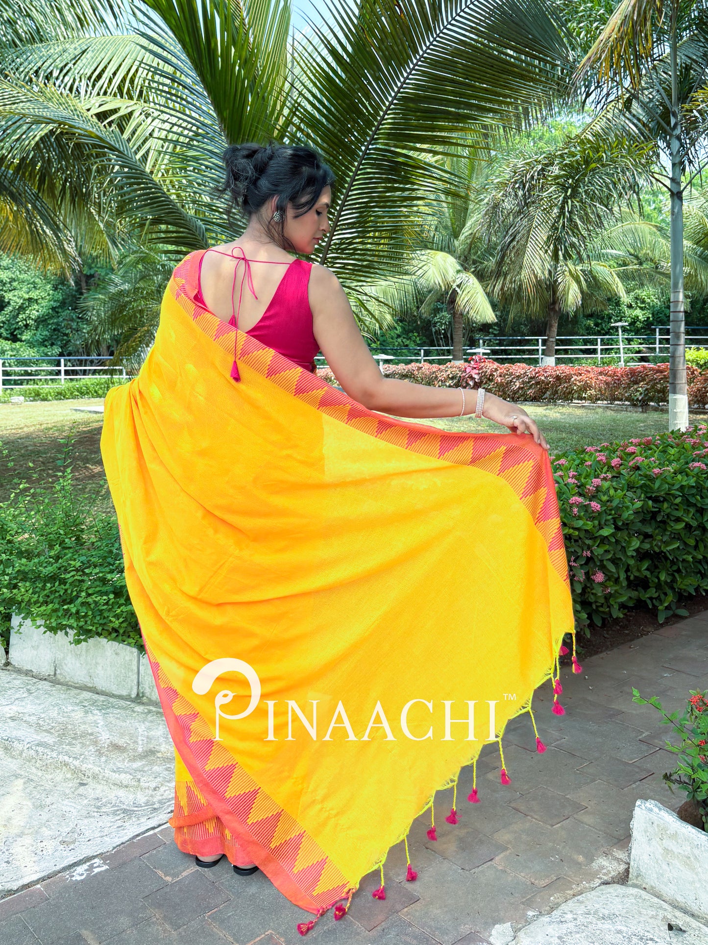 Mustard yellow cotton saree with vibrant pink borders, perfect for festive occasions