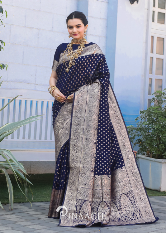 Elegant Pinaachi Navy Blue Banarasi Silk Saree with intricate silver zari work worn by model