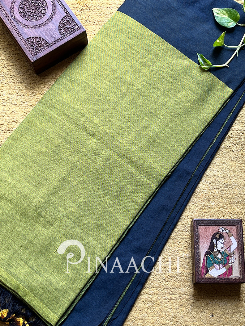 Olive green handloom cotton saree by Pinaachi with a contrasting navy blue border