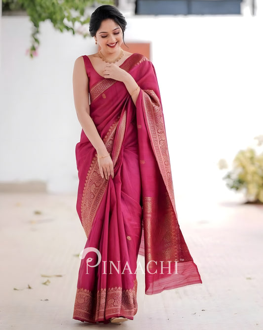 Elegant pink litchi silk saree by Pinaachi with intricate golden border and traditional design