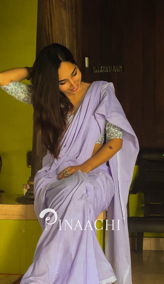 Elegant model wearing a lavender cotton handloom saree, showcasing its soft fabric and graceful drape.