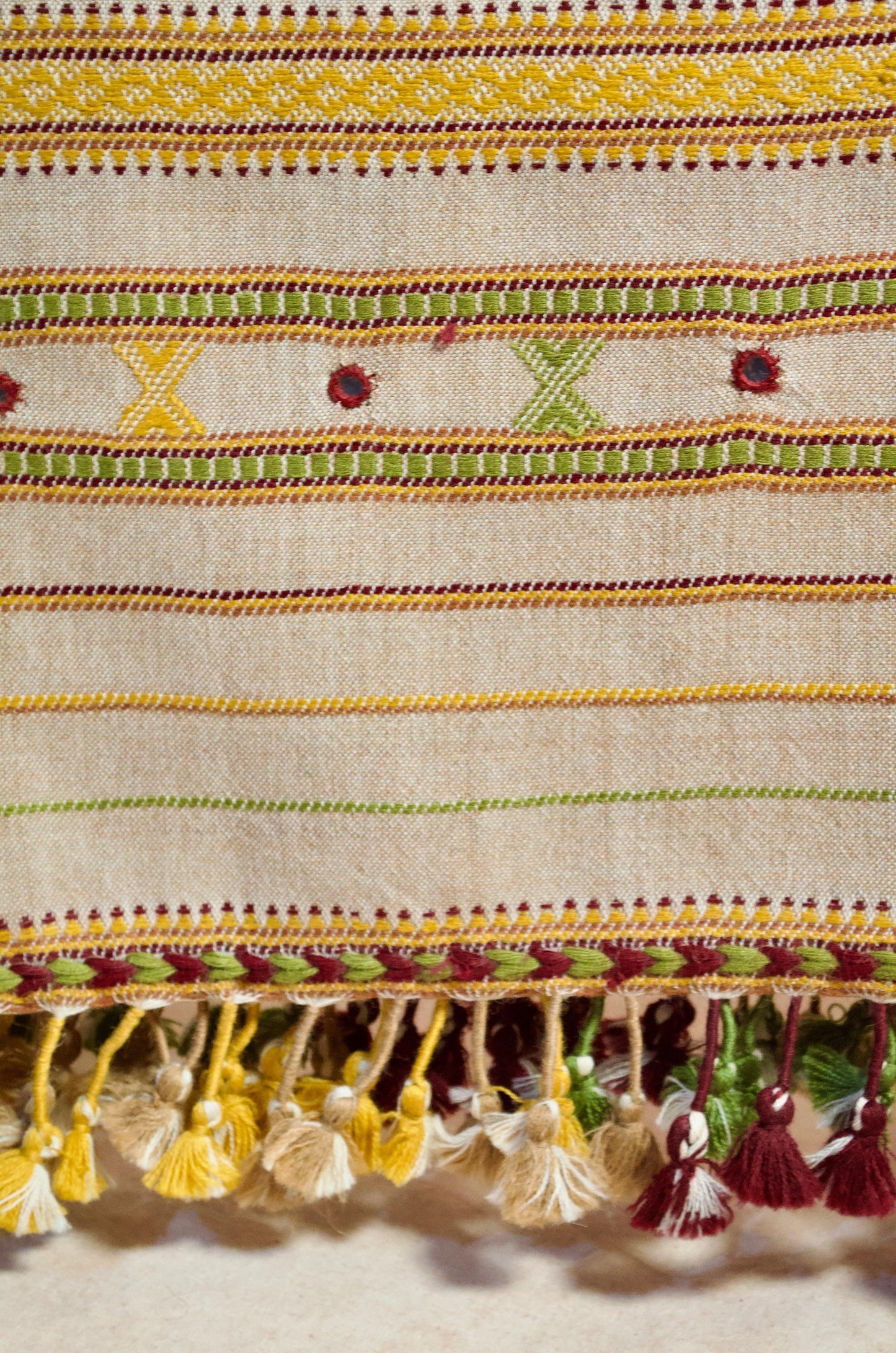 Beautiful pure merino wool stole with vibrant embroidery and colorful tassels