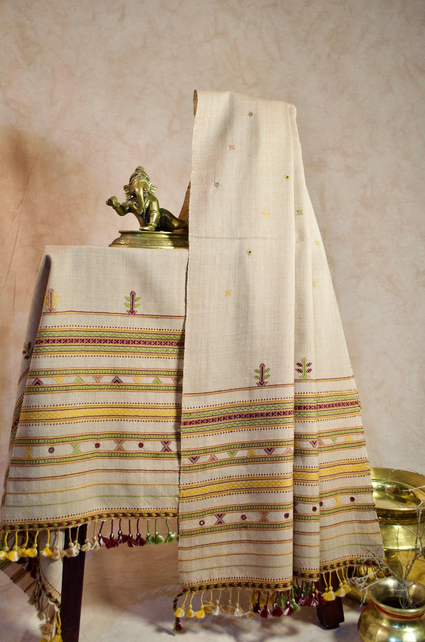 Elegant pure merino wool stole with intricate embroidery and tassel detailing, perfect for all seasons