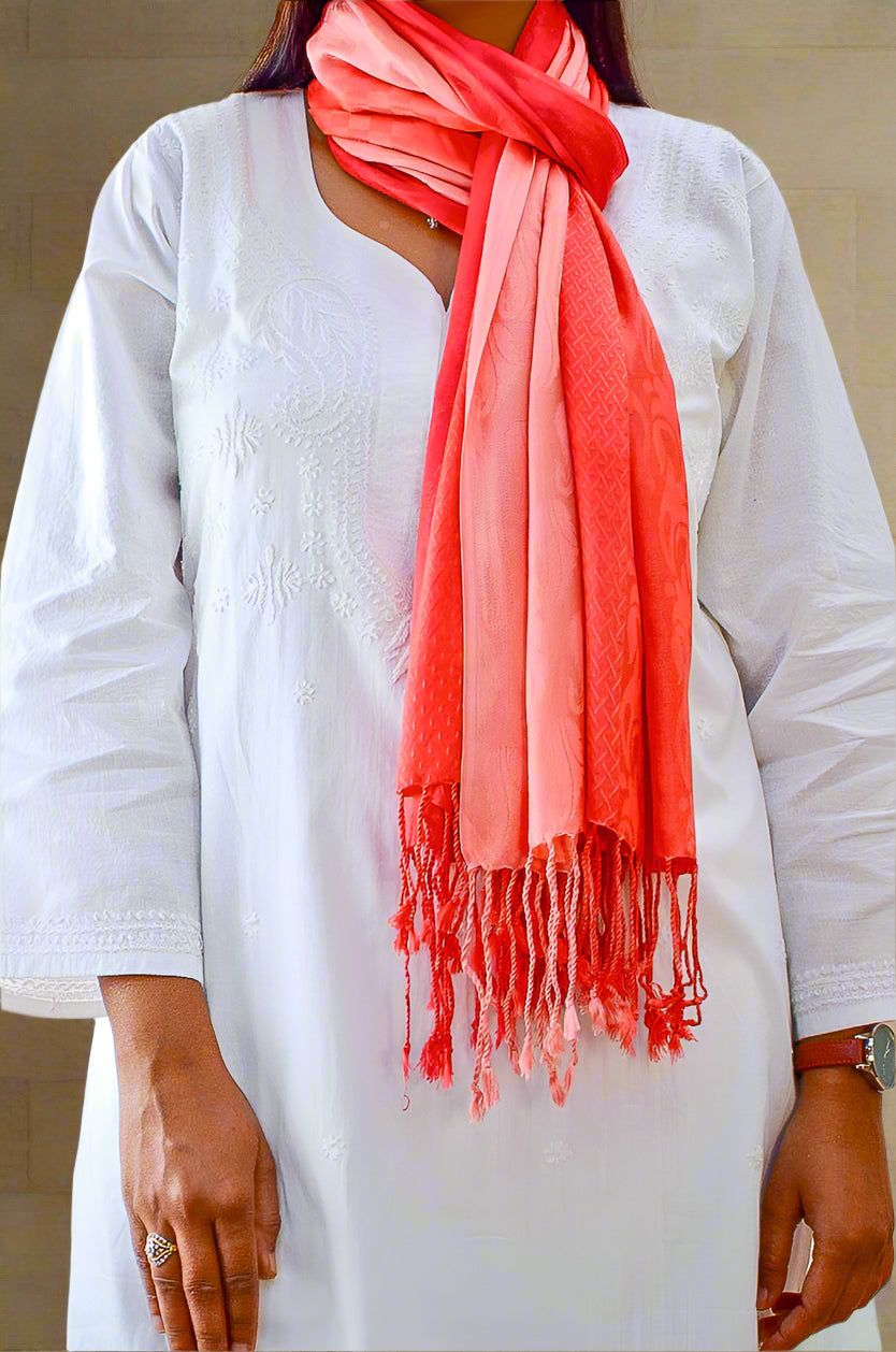Elegant red gradient jacquard stole draped stylishly over a white outfit