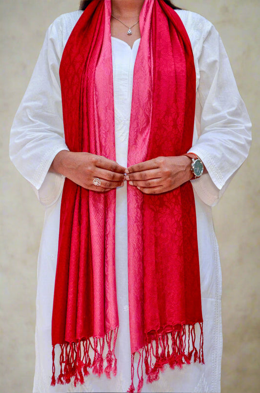 Elegant red gradient jacquard stole draped over a white outfit for a stylish look