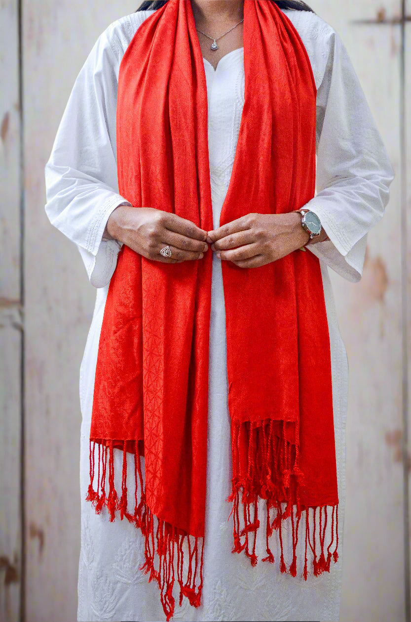 Stylish red jacquard stole for women with fringed edges, perfect for adding elegance to any outfit