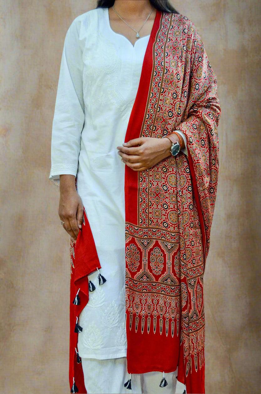 Pinaachi deep red hand block printed dupatta draped over white kurta with intricate traditional patterns