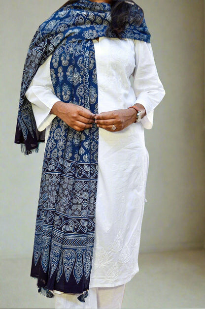 Ajrak hand block printed dupatta in blue, elegantly styled with a white kurta for a traditional look